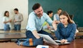 Annoying man student trying to talk with woman Royalty Free Stock Photo