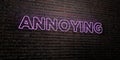 ANNOYING -Realistic Neon Sign on Brick Wall background - 3D rendered royalty free stock image