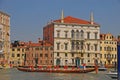 A group of elderly boat rowers with a very long boat taking a rest during the Vogalonga Regatta festival in Venice, Italy Royalty Free Stock Photo