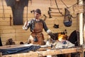 The annual festival in Kolomenskoye. Reconstruction of Ancient Rus. Blacksmith blows the bellows Royalty Free Stock Photo