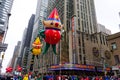 The annual Macy`s Thanksgiving Day parade along Avenue of Americas with many balloons floating in the air