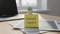 Annual report reminder on sticky note for business planning Royalty Free Stock Photo