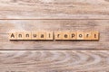 Annual report word written on wood block. Annual report text on wooden table for your desing, concept Royalty Free Stock Photo