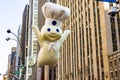 Annual Thanksgiving Macys parade with inflated Pillsbury Doughboy character