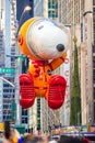 Annual Thanksgiving Macys parade with inflated Snoopy character