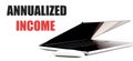 ANNUALIZED INCOME text on white background with laptop and mouse Royalty Free Stock Photo
