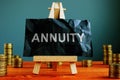 Annuity sign on the black sheet and coins