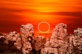 annular eclipse over stone on the rock of cliff