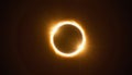 Annular solar eclipse glowing with fiery corona and starburst Royalty Free Stock Photo