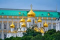 Annunciation Cathedral of the Moscow Kremlin with golden domes on a background of The Grand Kremlin Palace Royalty Free Stock Photo