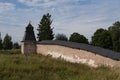 Annunciation Tower with fortress wall of Holy Dormition Pskovo-Pechersky Monastery. Pechory, Russia Royalty Free Stock Photo