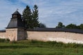 Annunciation Tower with fortress wall of Holy Dormition Pskovo-Pechersky Monastery. Pechory, Russia Royalty Free Stock Photo