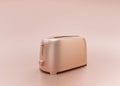 Anodized Rose Gold Material single color metallic shiny kitchen appliance, Toaster, on light pinkish color background, 3d