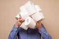 Anonym man stocking up toilet paper at home being afraid of coronavirus panic Royalty Free Stock Photo