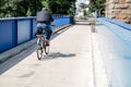 Anonymous bycycle driver on bridge Royalty Free Stock Photo