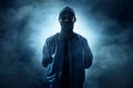 Anonymous computer hacker on smoke background