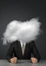 Anonymous concept, angry faceless businessman with head in clouds Royalty Free Stock Photo