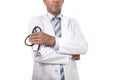 Anonymous crop face male medicine doctor holding stethoscope in his hand wearing medical gown