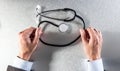 Anonymous doctor hands with stethoscope for symbol of medical career