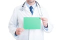 Anonymous doctor or medic holding green blank paper