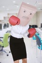 Anonymous entrepreneur wearing boxing gloves