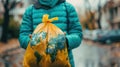 Anonymous Figure with World Map-Designed Plastic Bag: Advocate for Global Environmental Protection Royalty Free Stock Photo