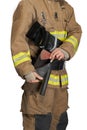 Anonymous firefighter pulling hammer from leather holster.