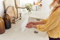 Anonymous girl washing hands in sink