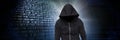 Anonymous hacker with computer code binary interface Royalty Free Stock Photo
