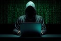 Anonymous hacker in dark hoodie typing on a laptop computer