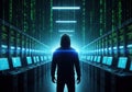 Anonymous hacker in a dark server room with glowing blue lights Royalty Free Stock Photo