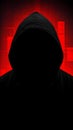 Anonymous hacker. Dark silhouette of a person in a hood against a background of blurred red holographic pixels