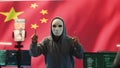 Anonymous hacker expert in a Chinese hacking high tech office