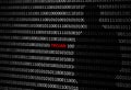 Anonymous hacker without face and trojan horse virus background