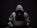 Anonymous hacker without face typing computer laptop. Concept of hacking cybersecurity, cybercrime, cyberattack, etc Royalty Free Stock Photo