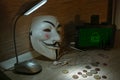 An anonymous hacker tries to crack the operating system`s protection