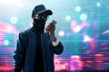 Anonymous hacker use mobile phone Royalty Free Stock Photo