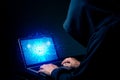 Hacker exploits AI-chip on a laptop in a dark cyber-security scene. Royalty Free Stock Photo