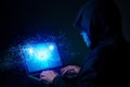 Hacker exploits AI-chip on a laptop in a dark cyber-security scene. Royalty Free Stock Photo