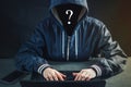 Anonymous hacker uses a laptop to hack the system. Stealing personal data. Creation and infection of malicious virus. Royalty Free Stock Photo