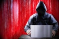 Anonymous hooded hacker, binary code - cyber attack concept Royalty Free Stock Photo
