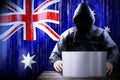 Anonymous hooded hacker, flag of Australia, binary code - cyber attack concept Royalty Free Stock Photo
