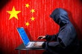 Anonymous hooded hacker, flag of China, binary code - cyber attack concept Royalty Free Stock Photo