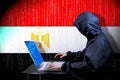 Anonymous hooded hacker, flag of Egypt, binary code - cyber attack concept Royalty Free Stock Photo