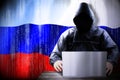 Anonymous hooded hacker, flag of Russia, binary code - cyber attack concept