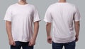 Anonymous male in blank black t-shirt, front and back view, isolated over gray background. Design men shirt mock up template or