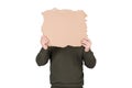 Anonymous man covers his head with a blank cardboard sheet, copy space for messages. Empty banner for advertising. Incognito Royalty Free Stock Photo