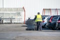 Anonymous man pulling shopping carts