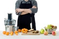 Anonymous man wearing an apron, preparing freshly made fruit juice, using modern electric juicer, healthy lifestyle concept Royalty Free Stock Photo