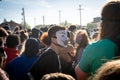 anonymous masked person among live protestors and demonstrators at minneapolis riots for george floyd